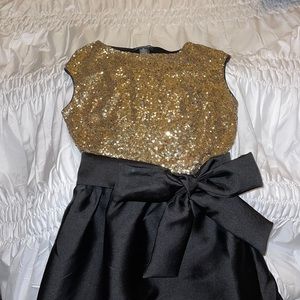 Long black and gold dress.